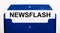 On a white background, a blue folder for papers. In the folder is a sheet of paper with the word NEWSFLASH