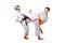 On a white background boys athletes train karate exercises