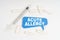 On a white background pills, a syringe and a blue plate with the inscription - ACUTE ALLERGY