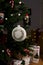 White ball with festive ornament copy space on a Christmas tree close-up
