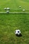 White ball on football soccer turf field green grass background