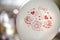 White balloon printed with hearts and other romantic symbols