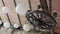 White balls and a wooden wheel with candle-lamps hang on the ceiling.