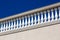 White balustrades with stone railing.