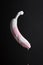 White banana with dripping pink paint, free space