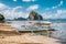 White banca island hopping boat at Las cabanas beach with amazing Pinagbuyutan island in background. El Nido, Palawan