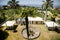 White banquet wedding tent with tall palm trees