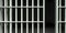 White Bar Jail Cell Front Unlocked