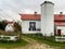 White barn with red white and blue quilt