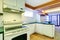 White basement kitchen room with green counter tops