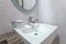 white basins in bathroom interior with granitic tiles
