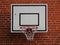 White Basketball Net Mounted on Red Brickwall