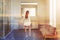 White bathroom with shower and sink, woman