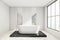 White bathroom space with black platform and ceramic bathtub