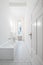 White bathroom - tiled bathroom with bathtub