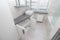 White bathroom with a window . Modern apartment. Spacious bathroom. White shell. The window in the bathroom. The design of the