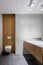 White bathroom with wooden details