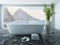 White bathtub in front of floor to ceiling window