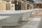 White bathtubs in a hardware store. The concept of choosing and installing bathtubs