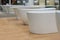 White bathtubs in a hardware store. The concept of choosing and installing bathtubs