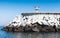 White beacon on concrete breakwater