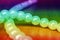 White beads. Multicolored rainbow gradient