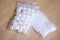 White beads. White artificial pearls of various sizes. Beads in the packages.