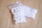White beads. White artificial pearls of various sizes. Beads in the packages.