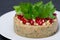 White bean pate with nuts and pomegranate, selective focus