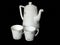 White beautiful tea pot and cups isolated