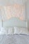 White bed and double pillow covered by messy wool with little or