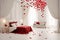 White bedroom decorated with red hearts.