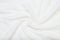 White beige delicate soft background of plush fabric