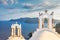 White belfries Santorini island, Greece