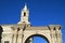 White Belfry and Side Arch of the Basilica Cathedral of Arequipa Against Vivid Blue Sky, Peru