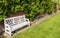 White Bench in an English Walled Garden