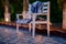 White Bench with Plaid Blankets on Patio at Dusk