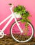 White bicycle on pink wall