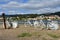 White bicycles in a road. River with blue water and small coastal village. Pontevedra, Galicia, Spain. Cloudy sky.