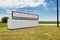 White billboard along a country road in rural Texas