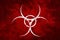 White biohazard sign over red background