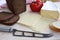 White and black bread, different varieties of cheese and knife view from above