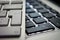 White and black computer keyboards, close-up to Enter keys