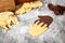 White and Black cookie dough, hands cutout, concept peace and intercultural friendship