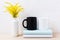 White and black mug mockup with ornamental yellow flowering grass