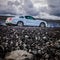 White black mustang lava road asphalt clouds