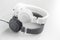 White and black wired stereo headphones on gray background