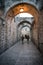 White and black women in military uniform walking in narrow street of the old city of Jerusalem. Jerusalem, Israel: 24 October,