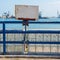 White blank grunge rusted sign attached to blue old metal fence revealing Suez Canal