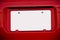 White Blank License Plate On Red Car